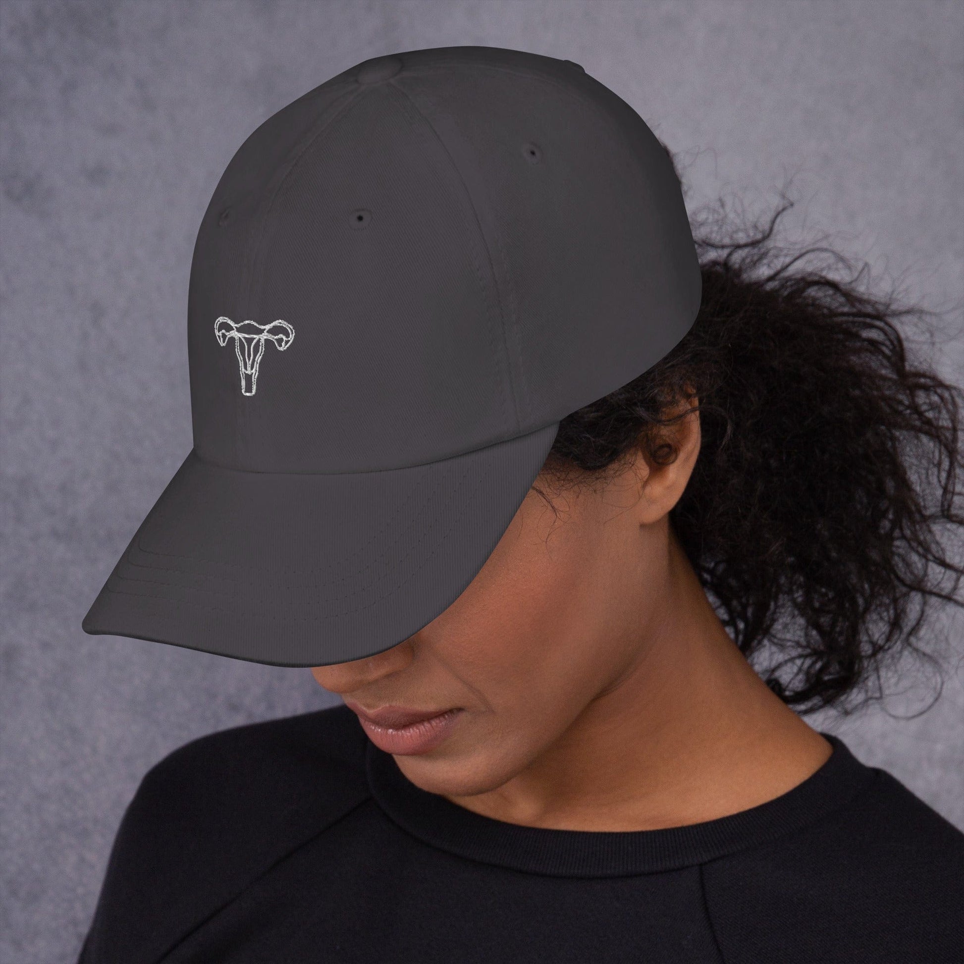 woman-wearing-unisex-uterus-embroidered-feminist-cap-hat-dark-grey-color-front